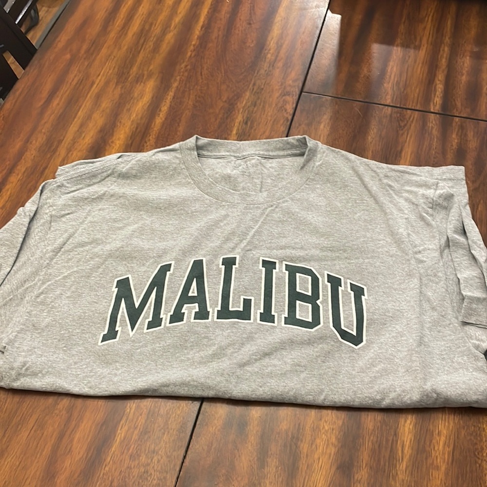 J. Galt, medium sized, gray tee with green lettered ‘MALIBU’ shirt.